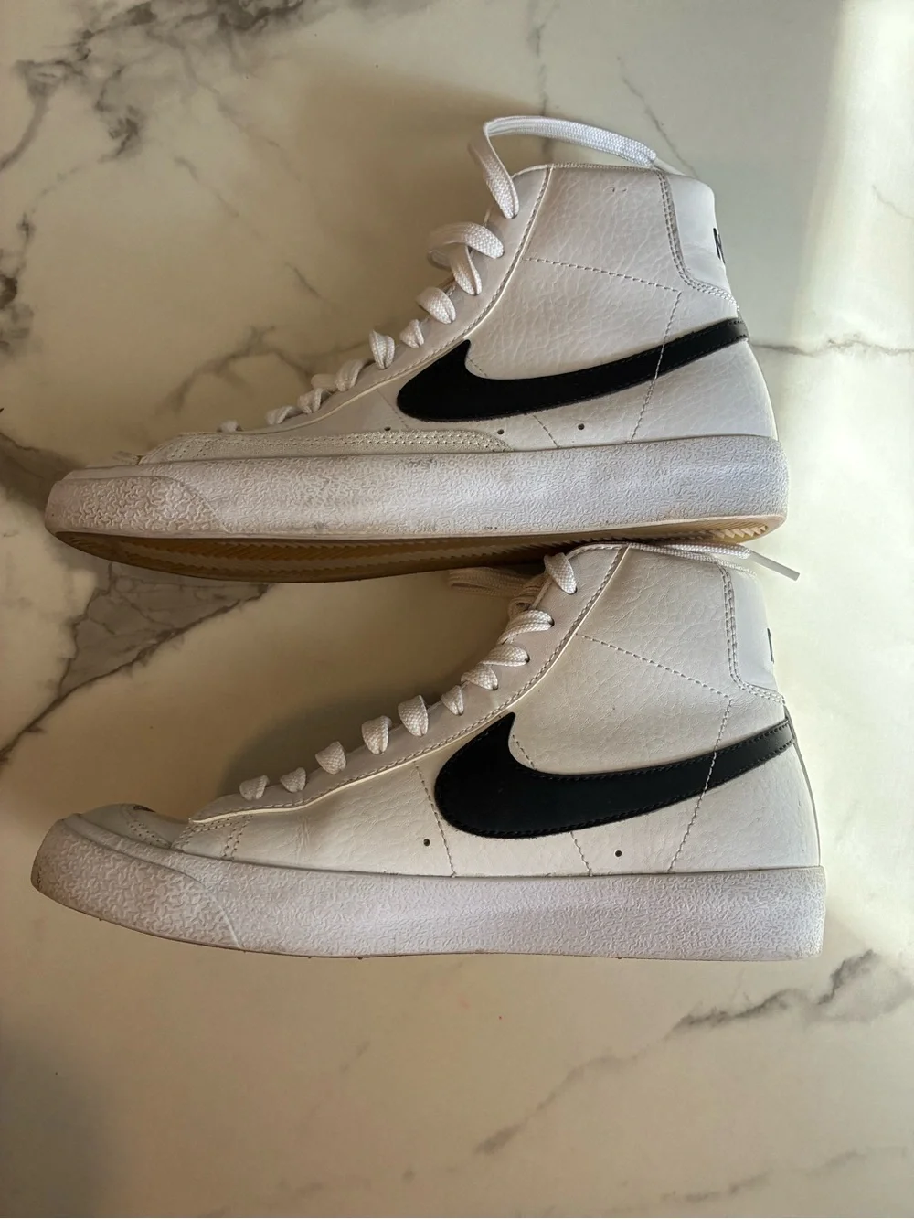 Nike White High-Top Sneakers with Black Swoosh Accent